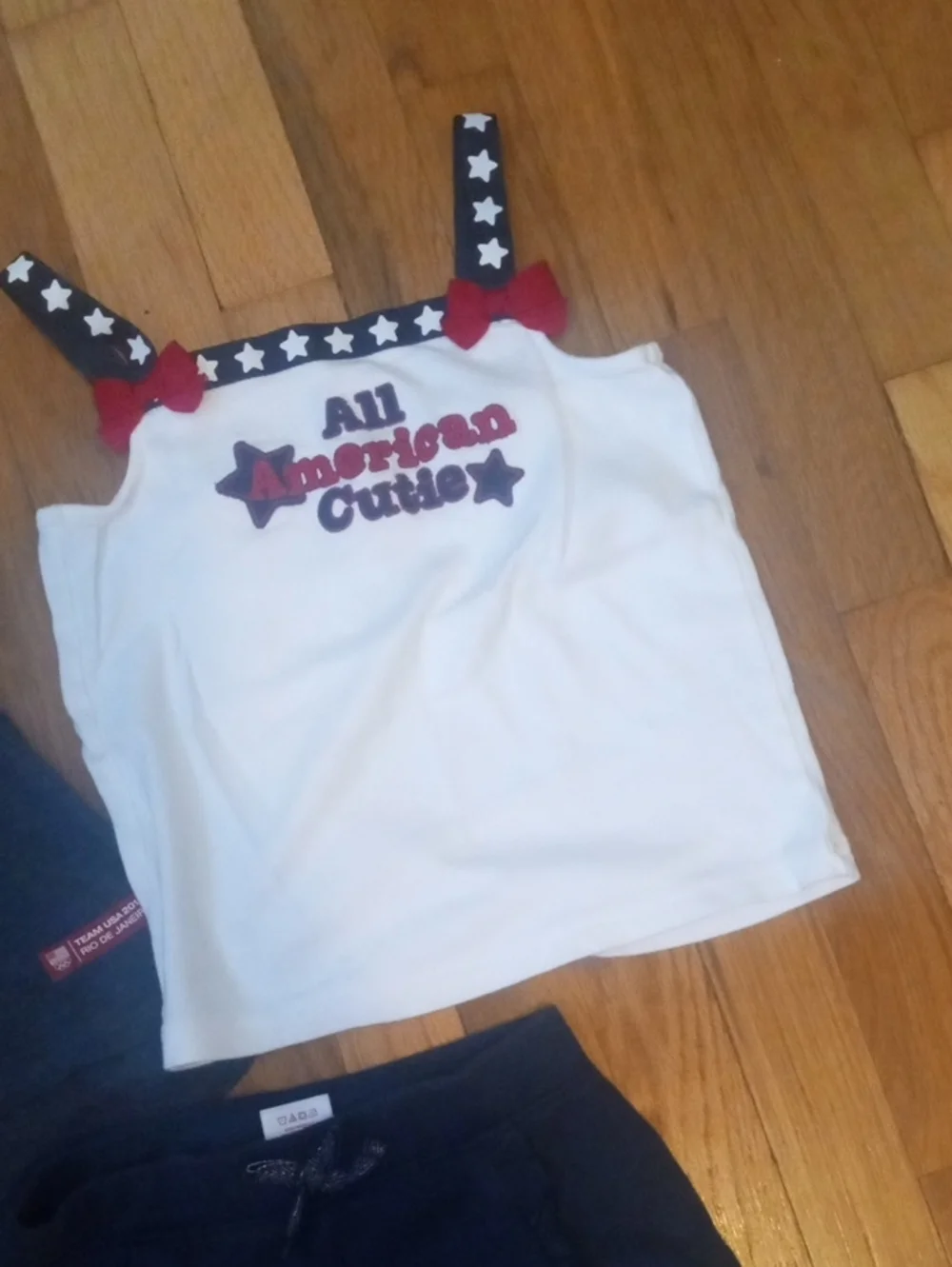 girl med blue shorts, and two tanks red white blue